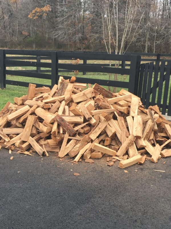 Half Cord of firewood on a driveway